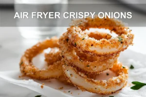 Air Fryer Crispy Onions: Simple Delicious Recipe AIR FRYER CRISPY ONIONS golden onion rings on white napkin with clear glass of water