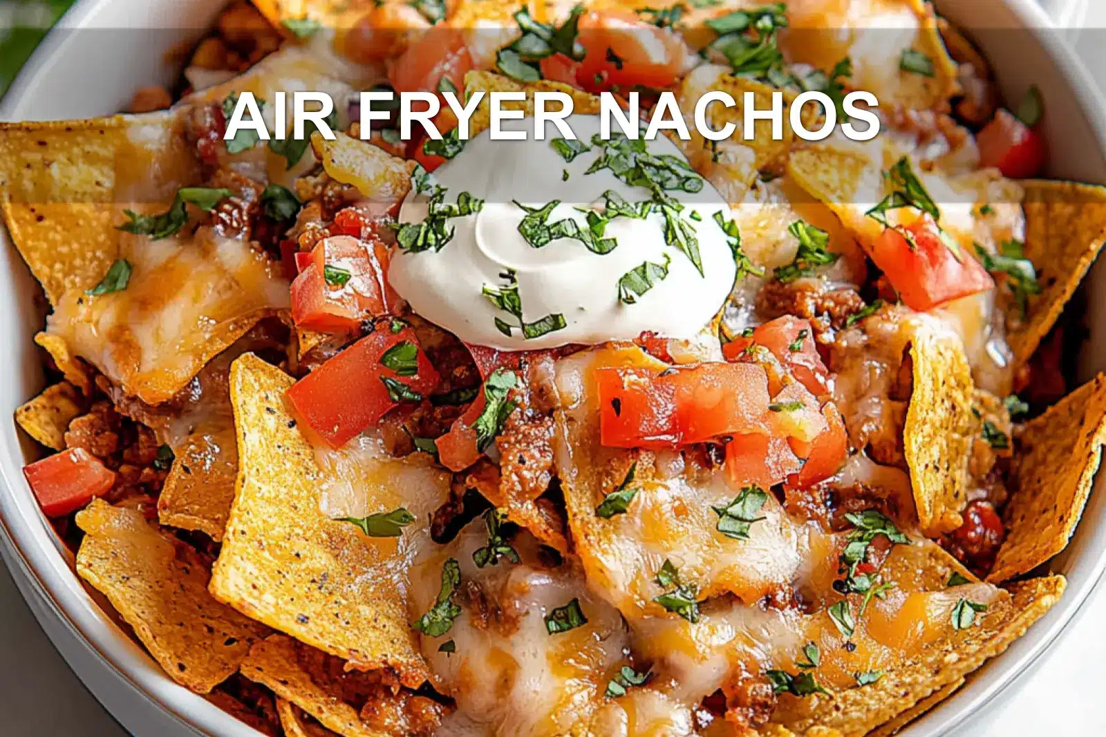 Loaded air fryer nachos with cheese, jalapeños, and ground beef