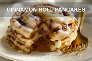 CINNAMON ROLL PANCAKES stacked with maple syrup and delicate white cheese glaze on white cloth