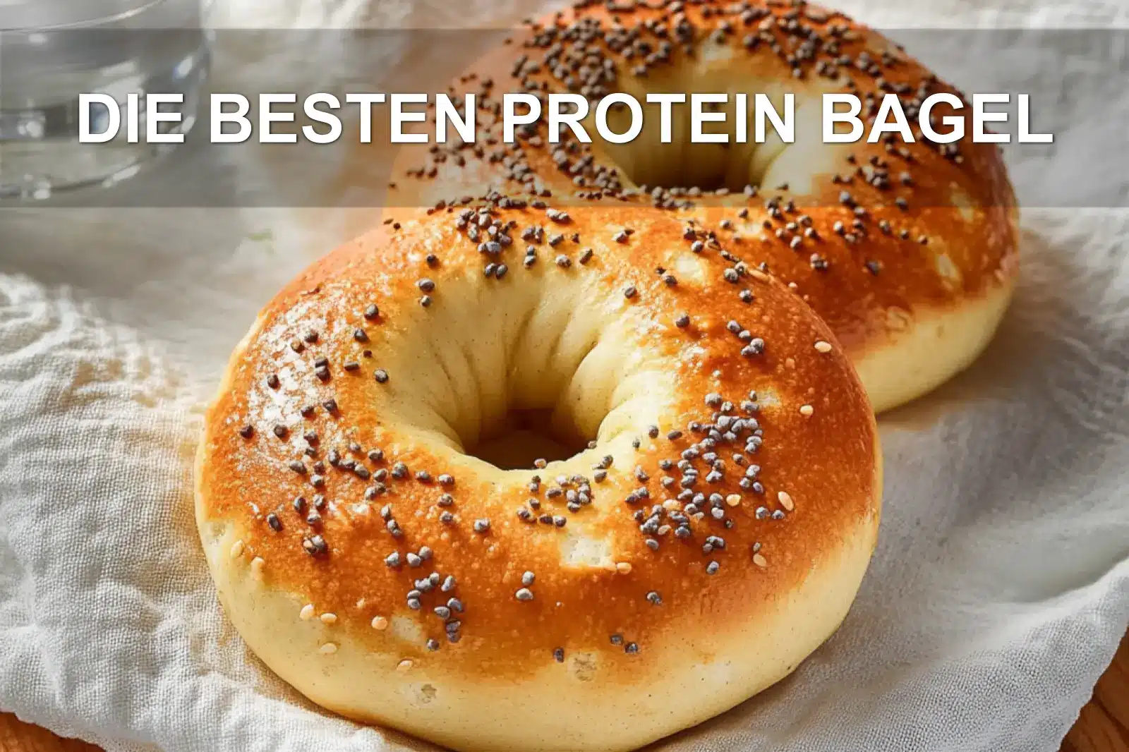 DIE BESTEN PROTEIN BAGEL spelt flour quark sesame poppy seeds shaped bagel rings on napkin