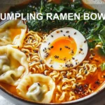 DUMPLING RAMEN BOWL with dumplings ramen eggs spinach green onions black sesame seeds