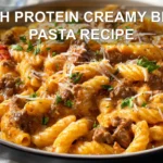 HIGH PROTEIN CREAMY BEEF PASTA RECIPE plated penne with ground beef creamy yogurt sauce fresh herbs