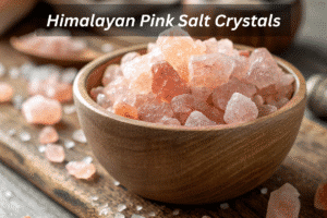 Himalayan pink salt crystals in a wooden bowl