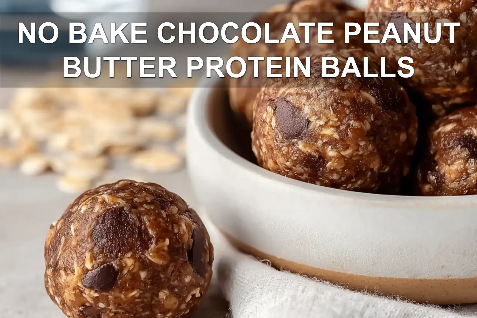 NO BAKE CHOCOLATE PEANUT BUTTER PROTEIN BALLS on wooden board with cloth and glass water