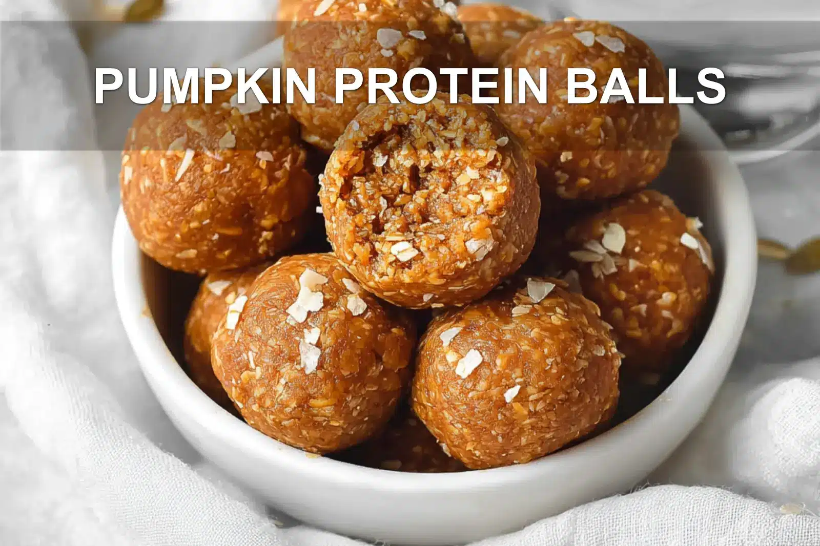 PUMPKIN PROTEIN BALLS on white napkin with warm natural light and soft shallow focus