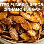 Roasted Pumpkin Seeds with Cinnamon Sugar Recipe 6 ROASTED PUMPKIN SEEDS WITH CINNAMON SUGAR centered hero view, clean and uncluttered