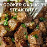 SLOW COOKER GARLIC BUTTER STEAK BITES centered hero view, clean and uncluttered