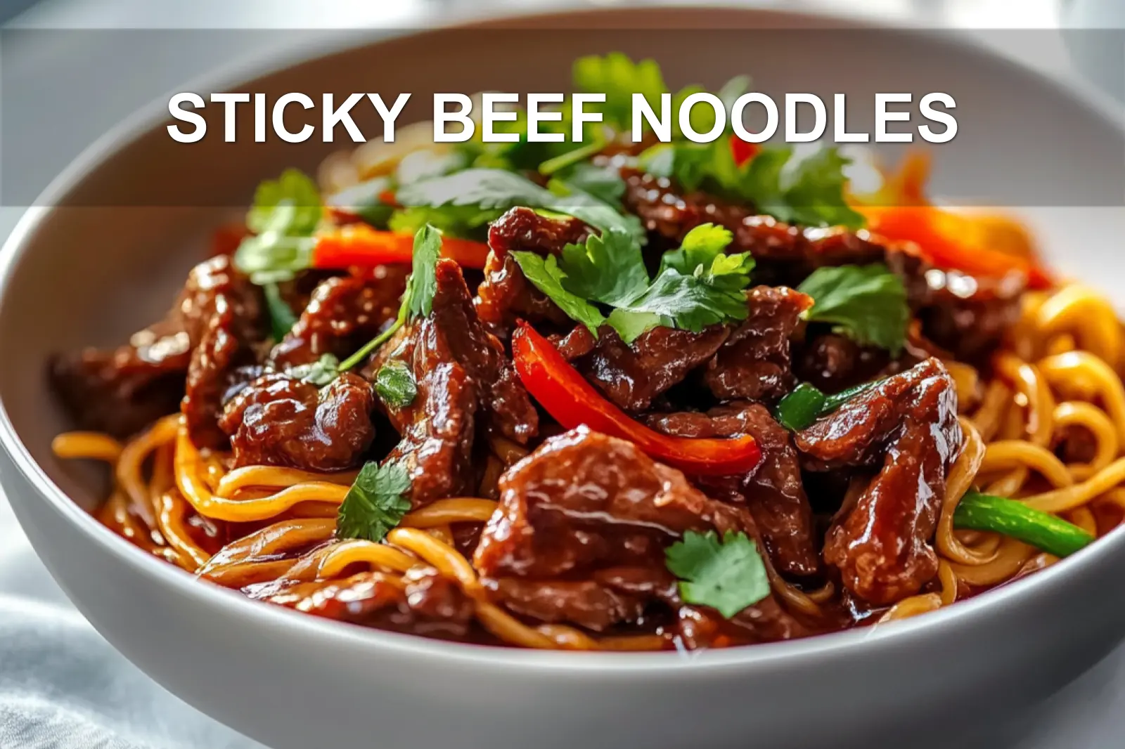 STICKY BEEF NOODLES close-up plated with sesame and green onions, warm natural light
