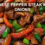 CHINESE PEPPER STEAK WITH ONIONS centered hero view, clean and uncluttered