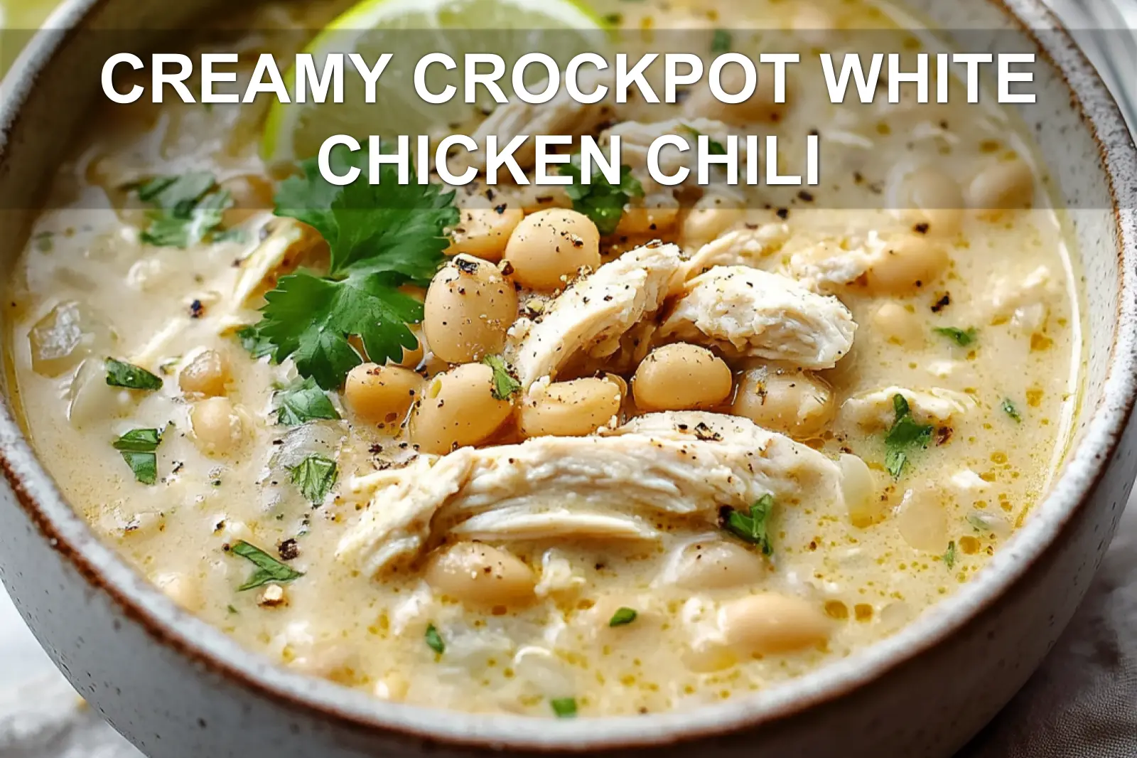 Creamy white chicken chili in a crockpot, ready to serve