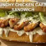 CRUNCHY CHICKEN CAESAR SANDWICH centered hero view, clean and uncluttered