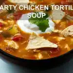 HEARTY CHICKEN TORTILLA SOUP centered hero view, clean and uncluttered