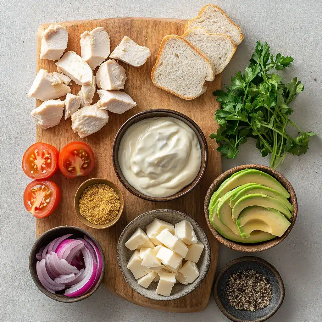 A perfectly grilled Chicken Avocado Melt Sandwich, golden and cheesy, with fresh avocado slices visible, centered on a clean background.