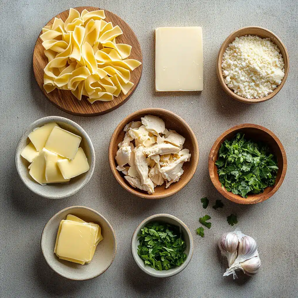 Chicken with Buttered Noodles Recipe: Irresistible Comfort Feast 5 Ingredients laid out for chicken with buttered noodles including raw chicken, egg noodles, butter, garlic, fresh herbs, and parmesan