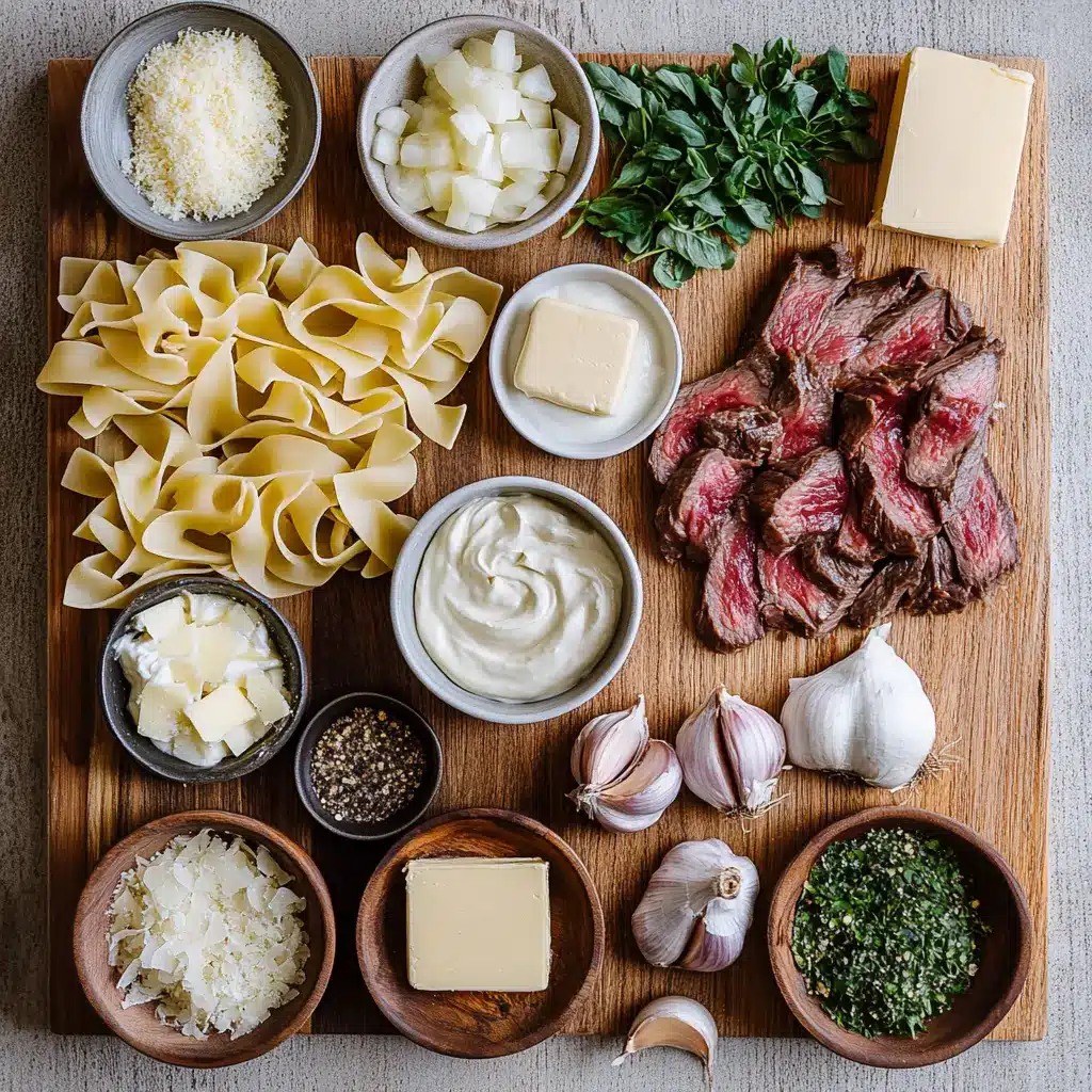 Overhead shot of creamy steak pasta ingredients, neatly arranged on a wooden board.