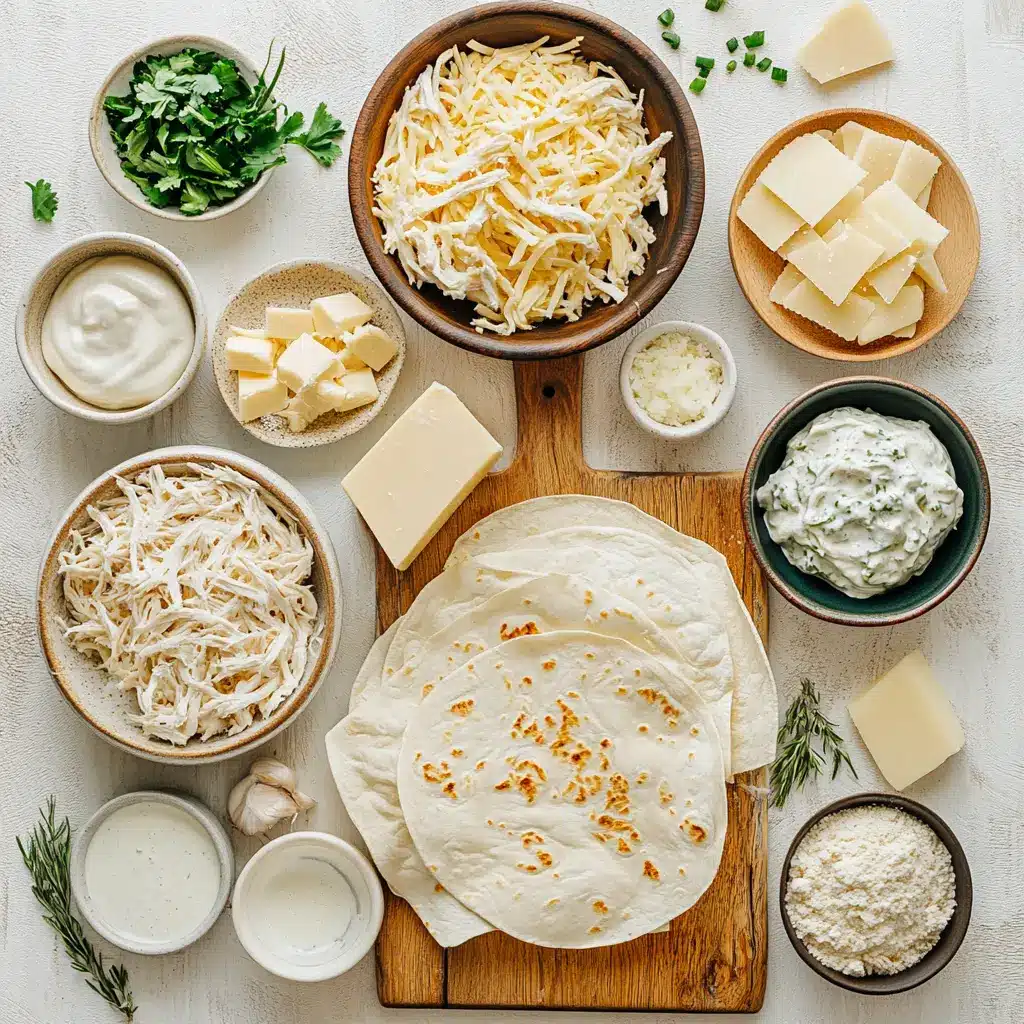 Ingredients laid out for easy creamy white chicken enchiladas including chicken, cheese, tortillas, and spices