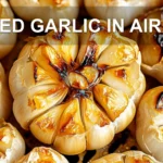 ROASTED GARLIC IN AIR FRYER centered hero view, clean and uncluttered