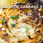 GRILLED GARLIC CABBAGE STEAKS centered hero view, clean and uncluttered