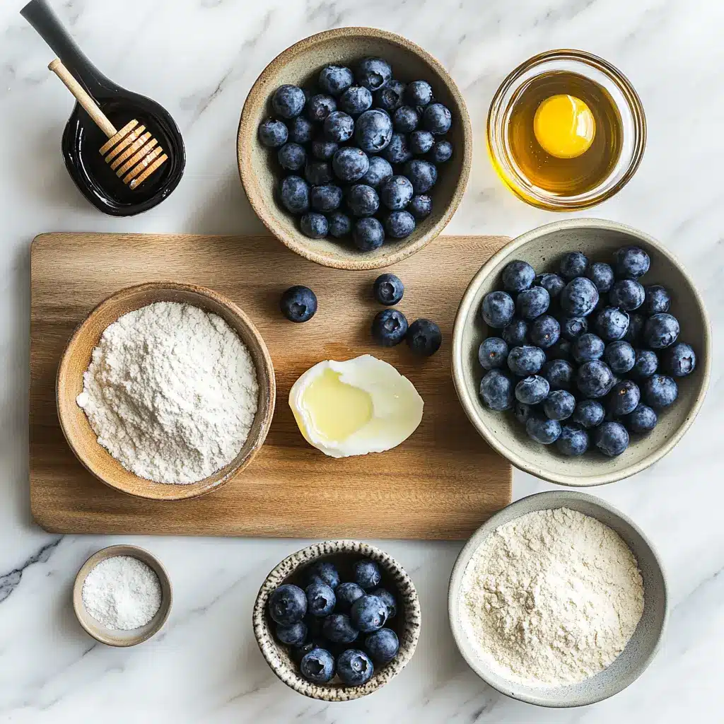 Homemade blueberry protein muffins, centered hero view, clean and uncluttered ingredients