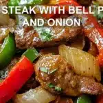 PEPPER STEAK WITH BELL PEPPERS AND ONION centered hero view, clean and uncluttered