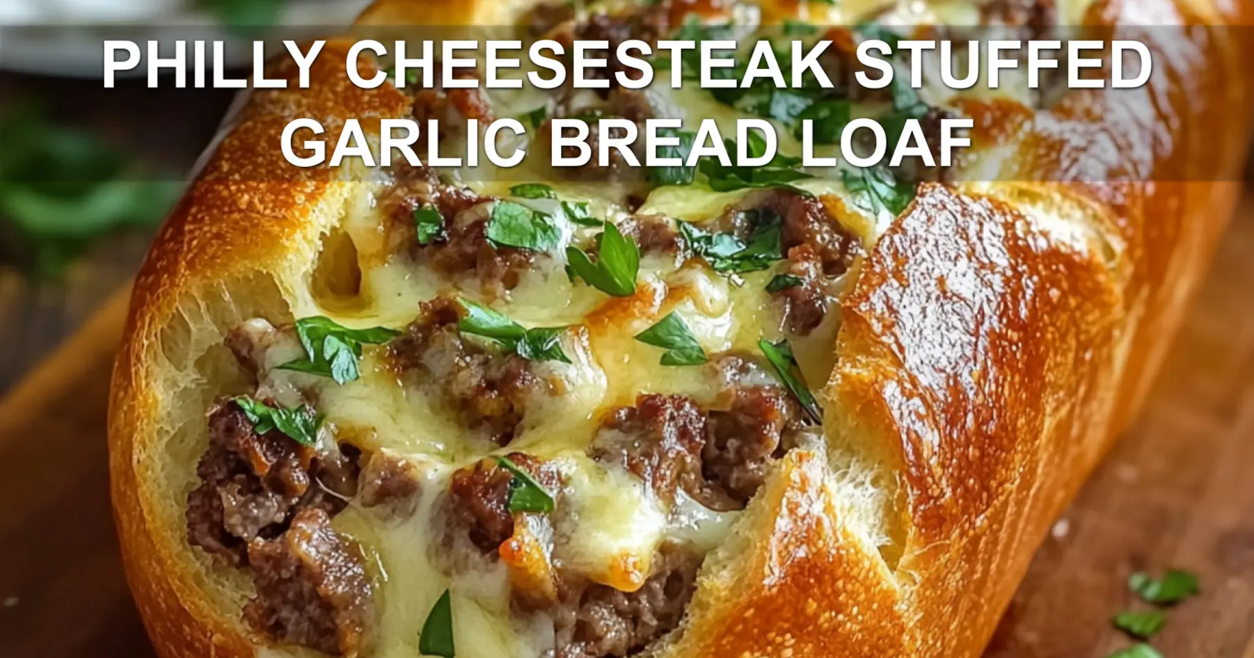 PHILLY CHEESESTEAK STUFFED GARLIC BREAD LOAF centered hero view, clean and uncluttered