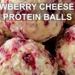 STRAWBERRY CHEESECAKE PROTEIN BALLS centered hero view, clean and uncluttered
