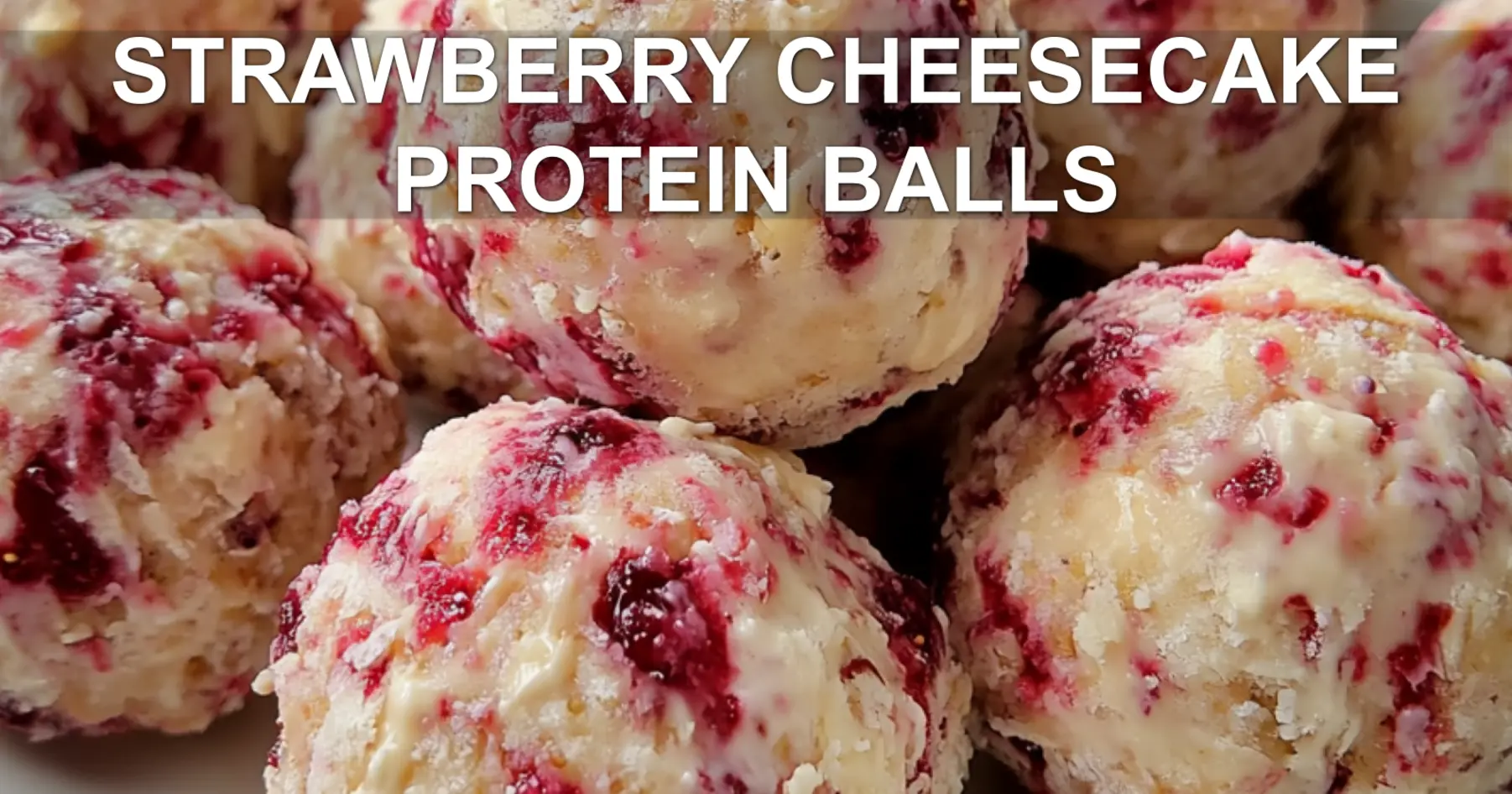 STRAWBERRY CHEESECAKE PROTEIN BALLS centered hero view, clean and uncluttered