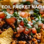 TIN FOIL PACKET NACHOS centered hero view, clean and uncluttered