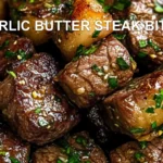 GARLIC BUTTER STEAK BITES centered hero view, clean and uncluttered