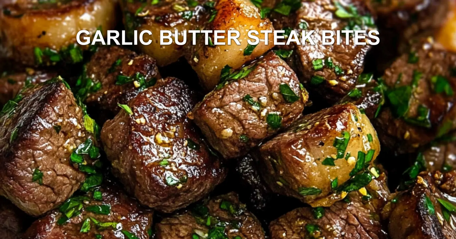 GARLIC BUTTER STEAK BITES centered hero view, clean and uncluttered