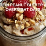 HIGH PROTEIN PEANUT BUTTER AND JELLY OVERNIGHT OATS centered hero view, clean and uncluttered
