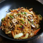 VEGETABLE LO MEIN WITH CABBAGE AND MUSHROOMS centered hero view, clean and uncluttered