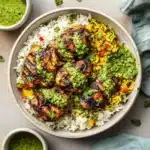 PERUVIAN CHICKEN AND RICE WITH GREEN SAUCE centered hero view, clean and uncluttered