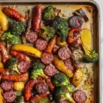 SHEET PAN SAUSAGE AND VEGETABLES centered hero view, clean and uncluttered