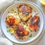 AIR FRYER LEMON GARLIC CHICKEN THIGHS centered hero view, clean and uncluttered