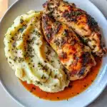 GARLIC HERB CHICKEN WITH MASHED POTATOES centered hero view, clean and uncluttered