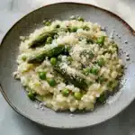 RISOTTO WITH ASPARAGUS AND PEAS centered hero view, clean and uncluttered