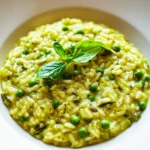 SPRING RISOTTO WITH ASPARAGUS AND PEAS centered hero view, clean and uncluttered
