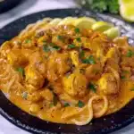 THAI INSPIRED COCONUT RED CURRY CHICKEN UDON centered hero view, clean and uncluttered