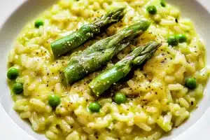 SPRING RISOTTO WITH ASPARAGUS AND PEAS centered hero view, clean and uncluttered